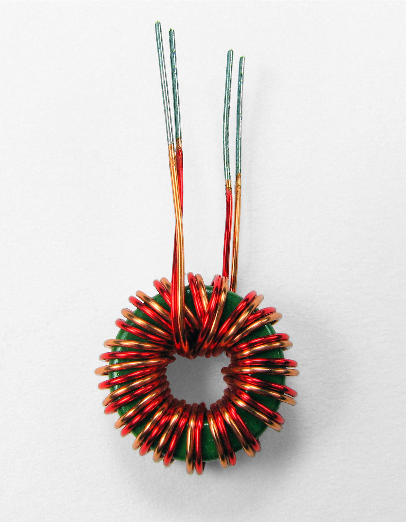Figure 3 — A bifilar-wound toroidal ferrite transformer — the winding technique (two conductors run side by side through the core on every turn) this DIY 4:1 balun's construction depends on. Photo: File:Bifil…